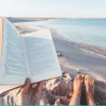 Person reading on the beach summer reading for teachers and tutors